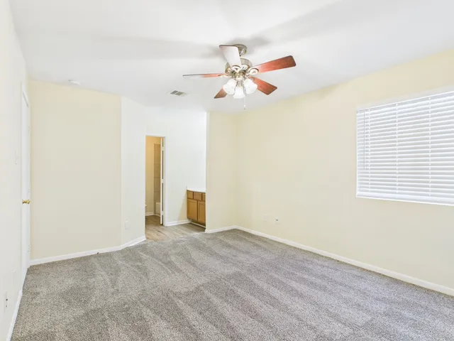 a bathroom with a toilet a sink a mirror and a shower