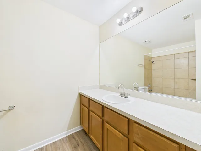 a bathroom with a toilet and a bathtub