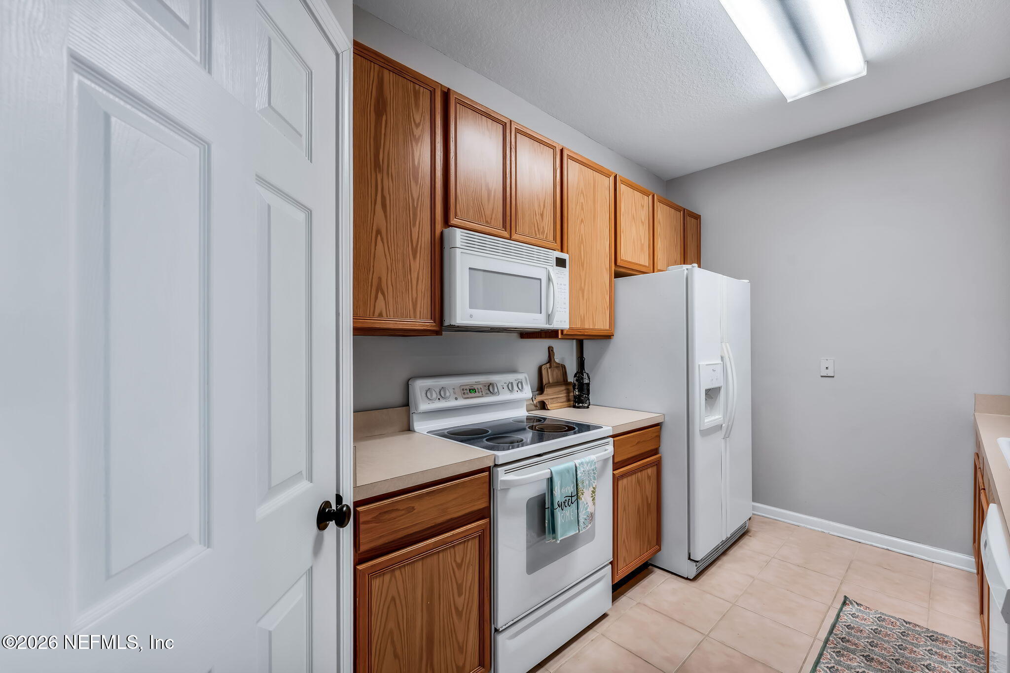 7990 Baymeadows Road East, Unit 520 Jacksonville, FL 32256 - Photo 7 of 41 a kitchen with a refrigerator sink and stove