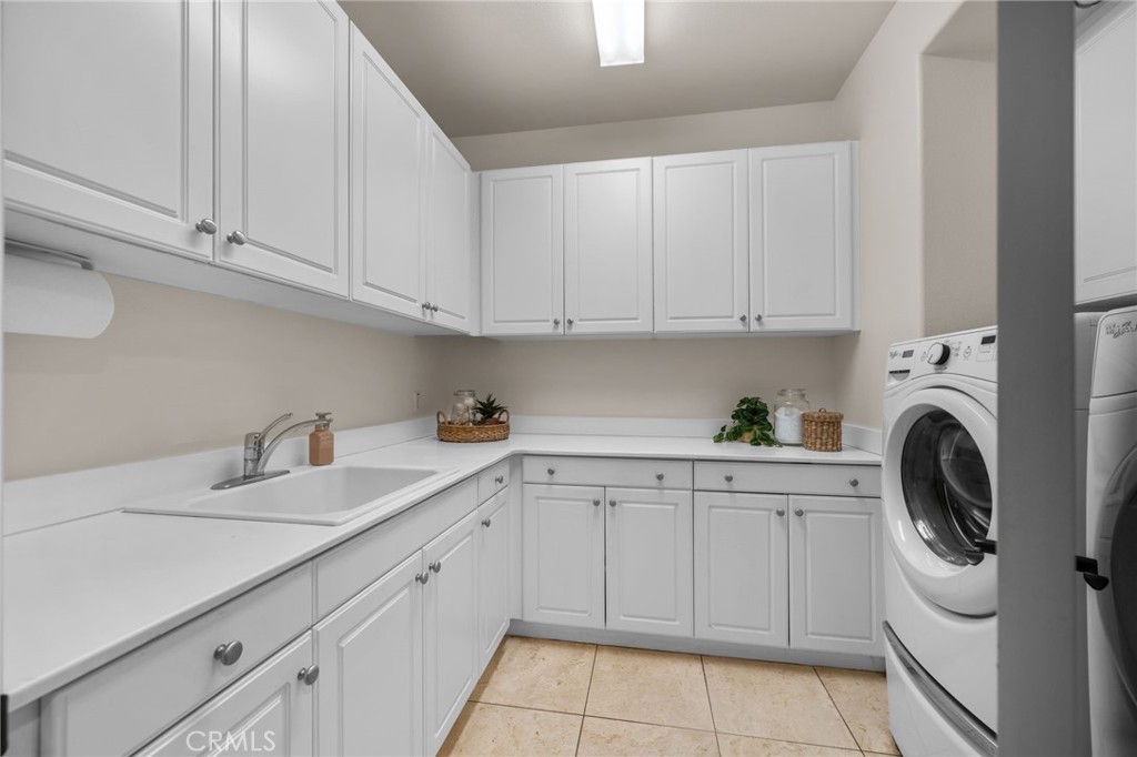 5497 Glen Ridge Court Rancho Cucamonga, CA 91739 - Photo 22 of 70 laundry room with sink