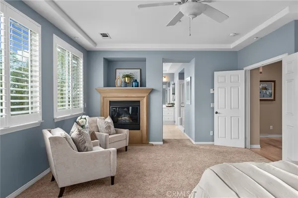 a bedroom with furniture and a window
