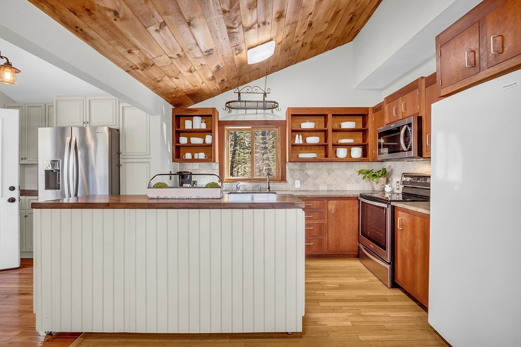 337 Hubbardston Road Princeton, MA 01541 - Photo 11 of 42 a kitchen with stainless steel appliances granite countertop a stove a sink dishwasher and a refrigerator