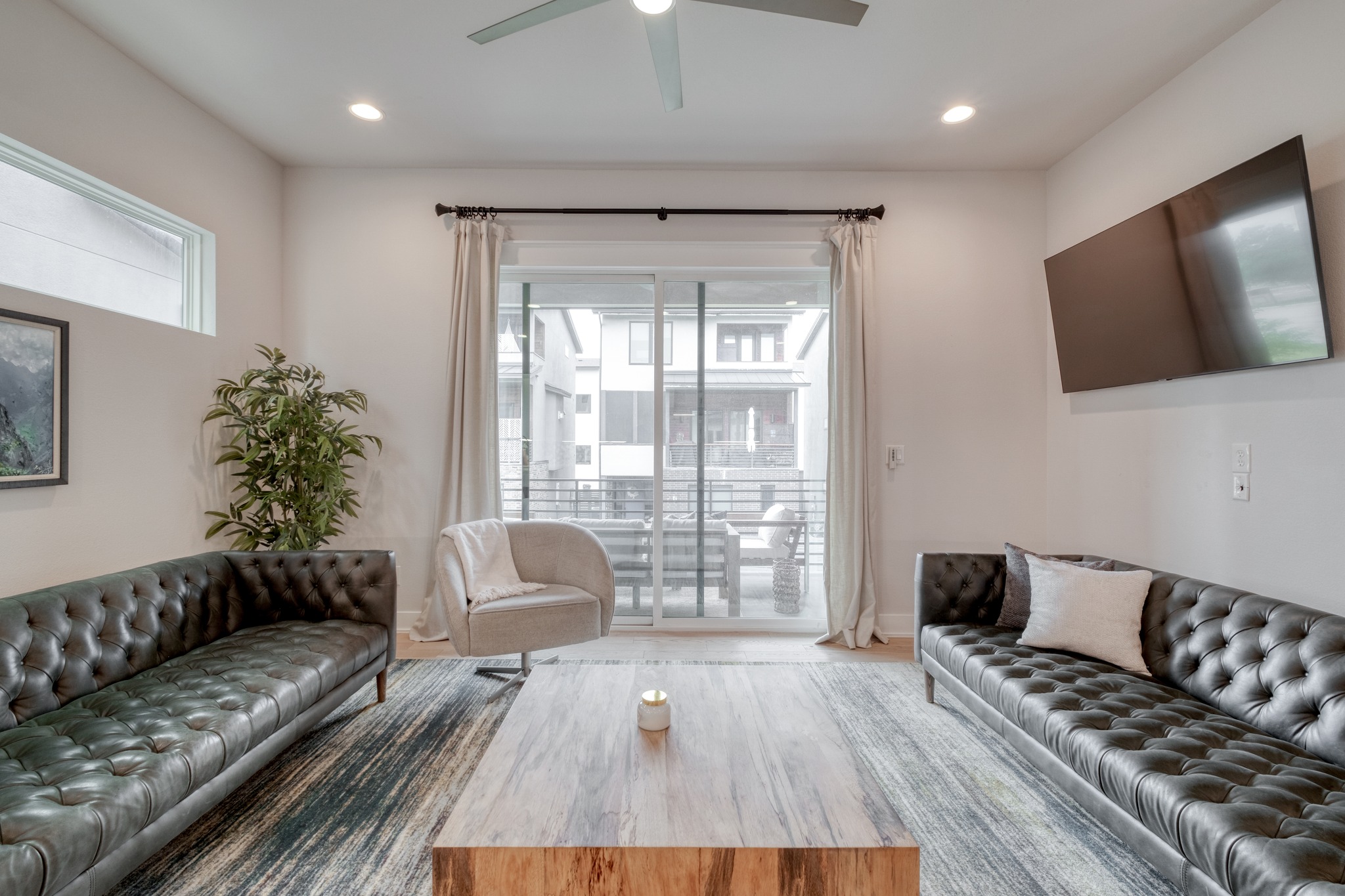 5002 Pecan Springs Road, Unit 7 Austin, TX 78723 - Photo 8 of 34 The second floor opens into a spacious living room where the neutral walls and natural light emphasize the open-concept layout