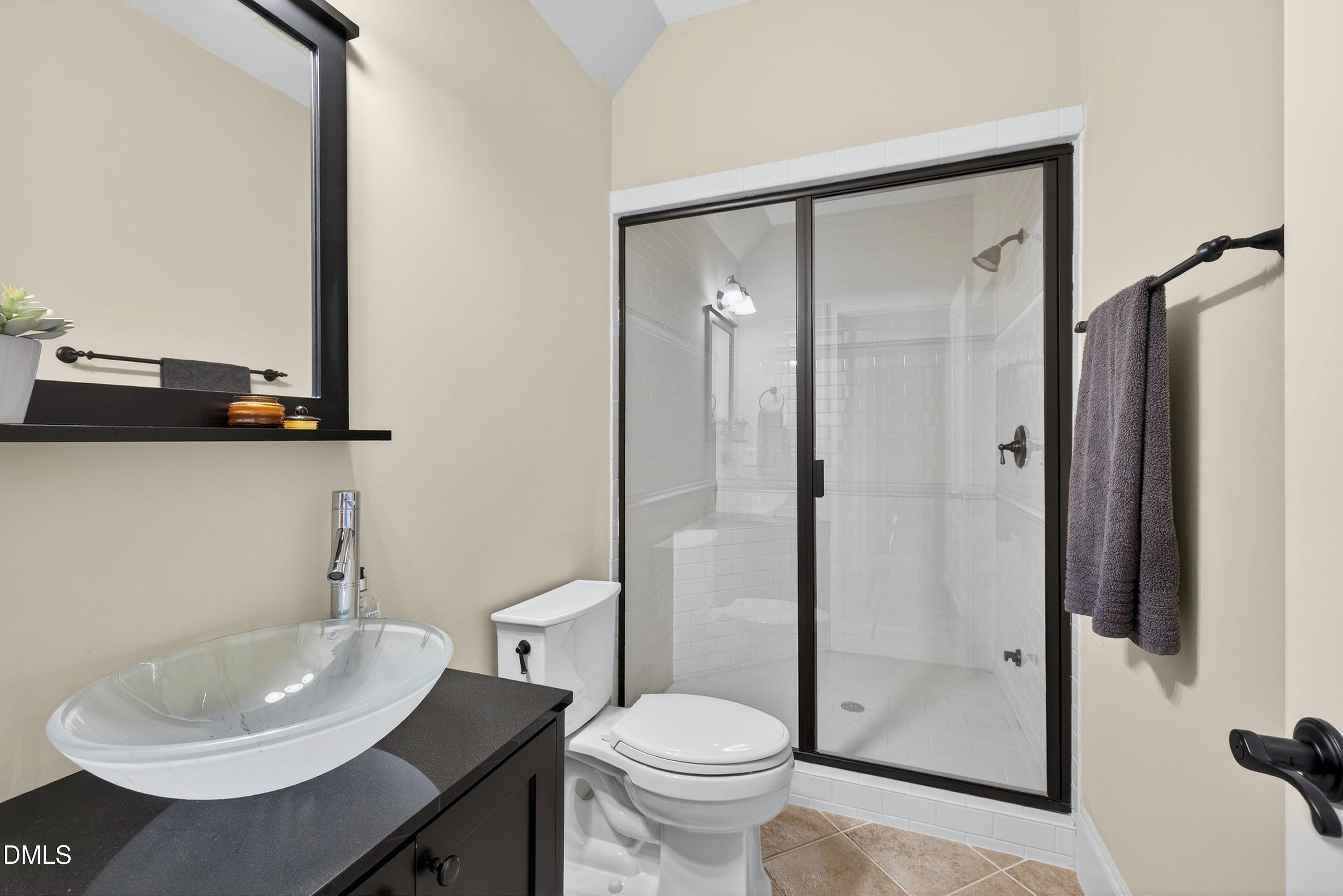 6701 Foxfire Place Raleigh, NC 27615 - Photo 49 of 67 a bathroom with a sink toilet and shower