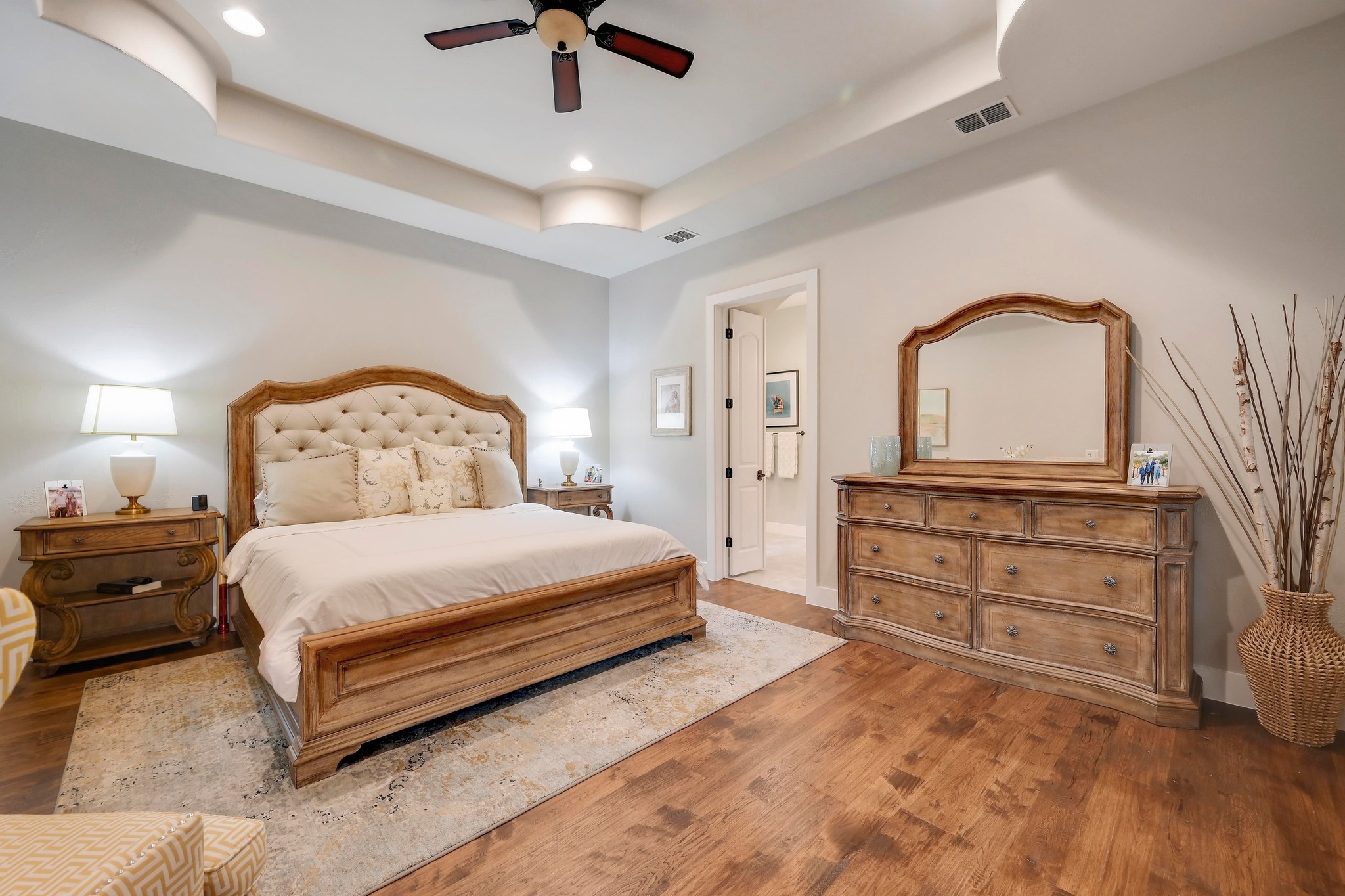 401 Trail Ridge Road Wimberley, TX 78676 - Photo 10 of 34 Bedroom featuring a raised ceiling, wood finished floors, a ceiling fan, and recessed lighting
