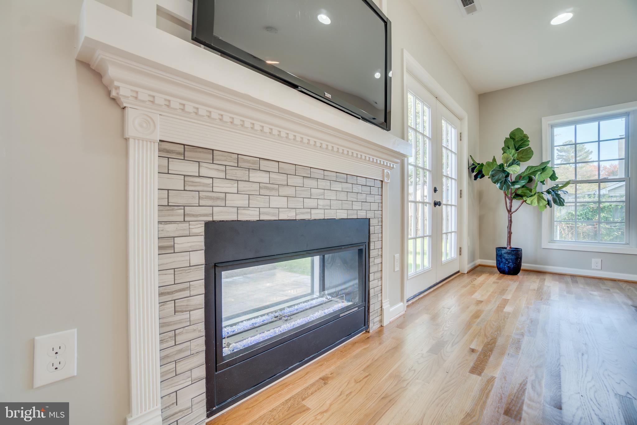 9907 Merwood Lane Silver Spring, MD 20901 - Photo 21 of 56 Dual sided fireplace.