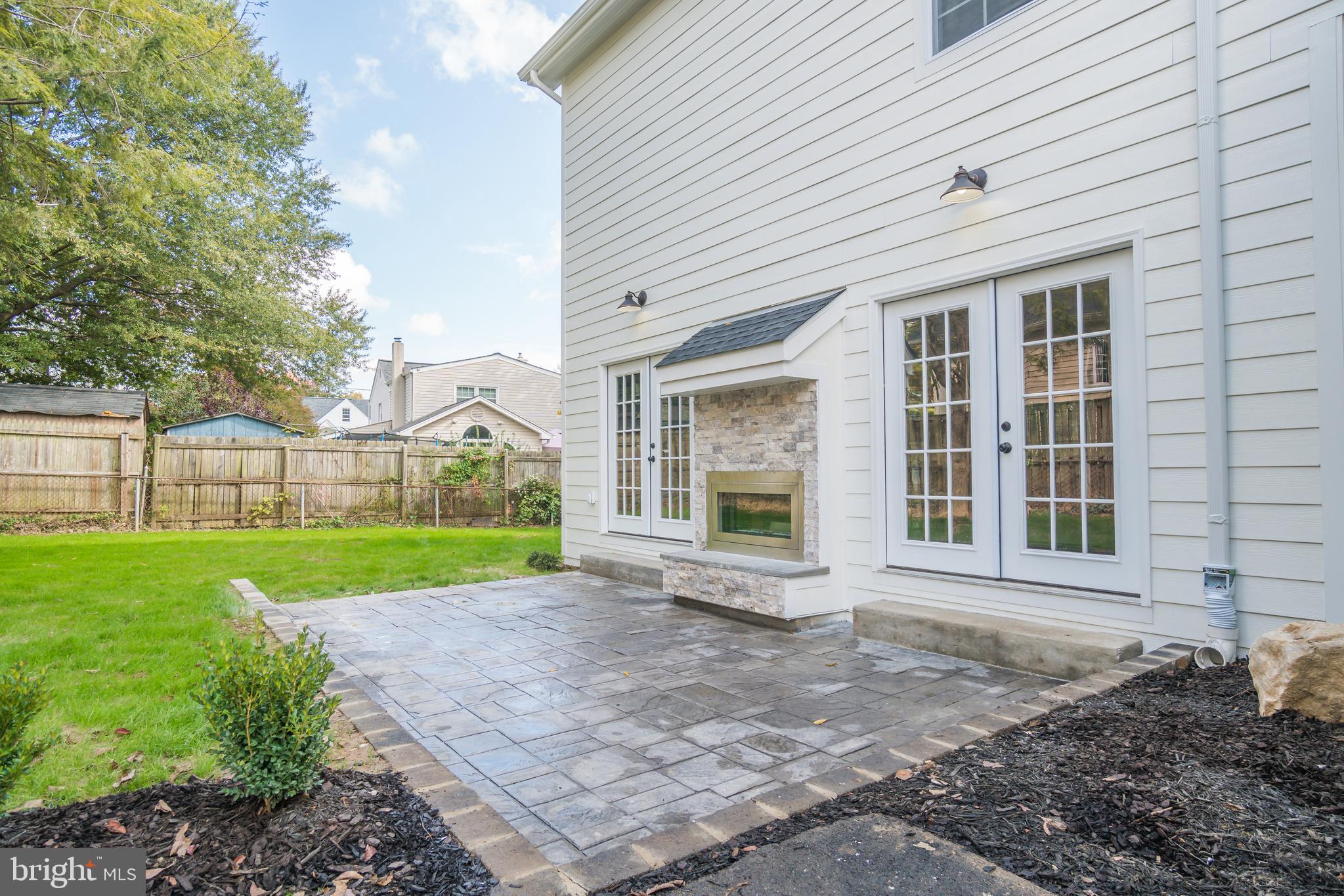 9907 Merwood Lane Silver Spring, MD 20901 - Photo 50 of 56 Patio with outdoor fireplace.