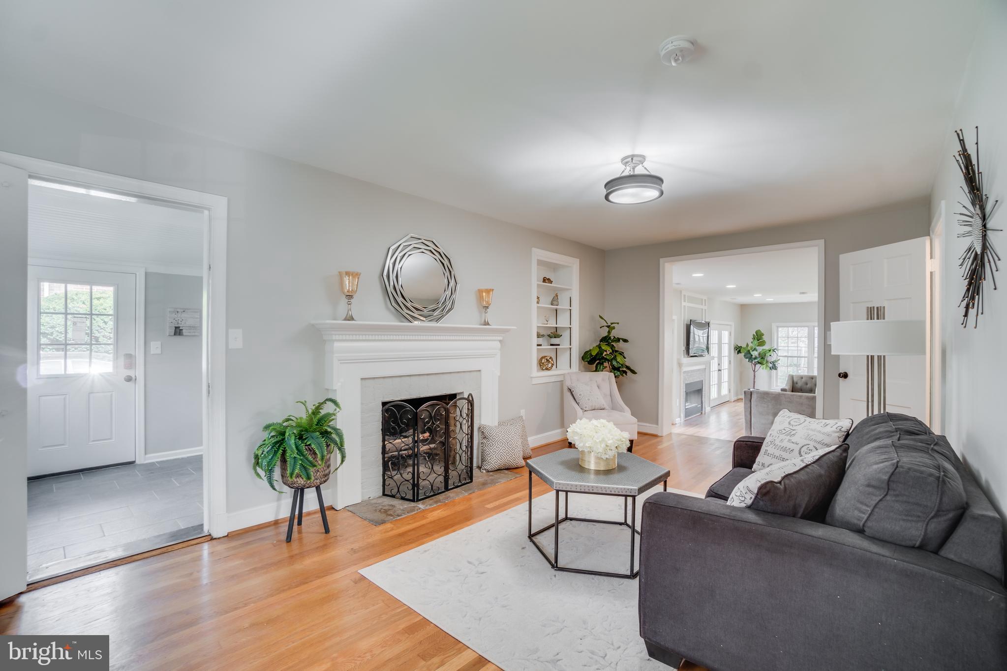 9907 Merwood Lane Silver Spring, MD 20901 - Photo 7 of 56 Formal living room with wood burning fireplace.