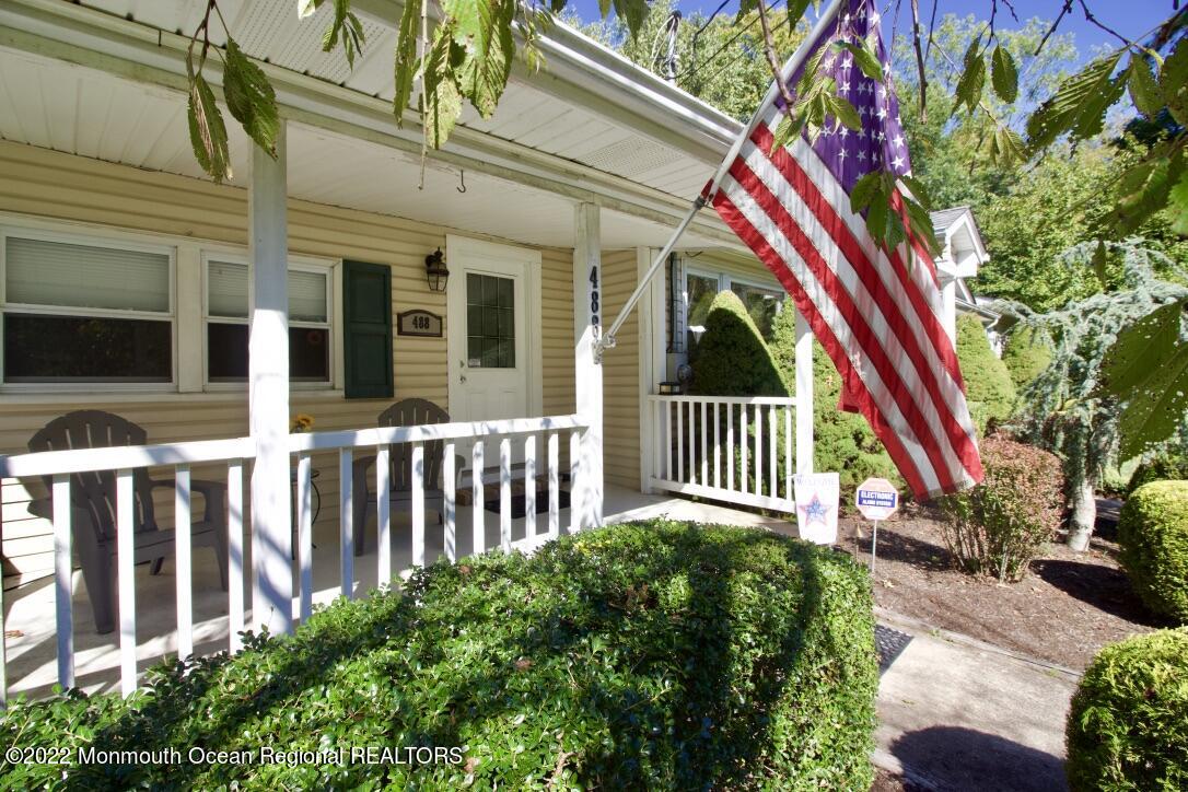 488 Freehold Road Jackson, NJ 08527 - Photo 6 of 19 a view of a house with a small yard and flower plants