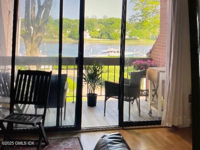 7 River Road, Unit 306 Cos Cob, CT 06807 - Photo 11 of 20 a view of living room with a floor to ceiling window and wooden floor