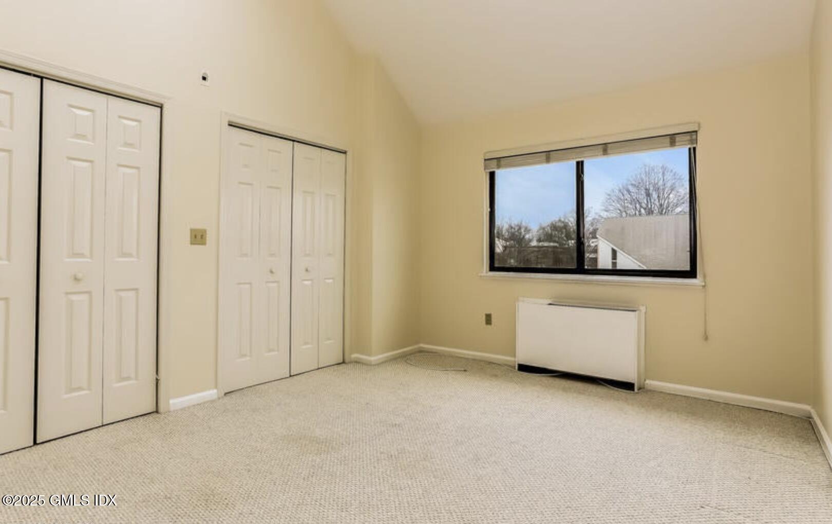 7 River Road, Unit 306 Cos Cob, CT 06807 - Photo 17 of 20 a view of an empty room with painting on the wall