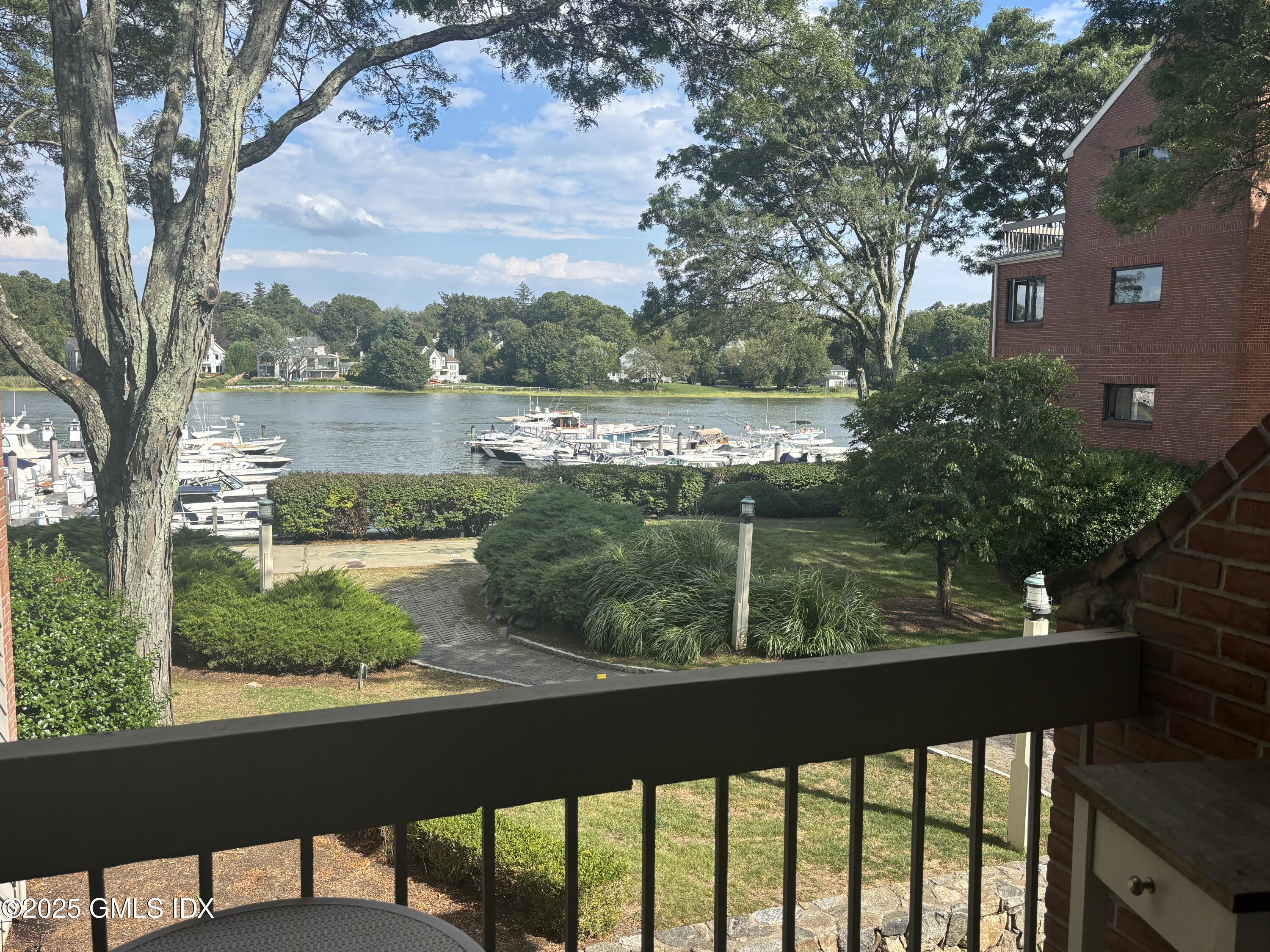 7 River Road, Unit 306 Cos Cob, CT 06807 - Photo 2 of 20 a view of a lake from a balcony