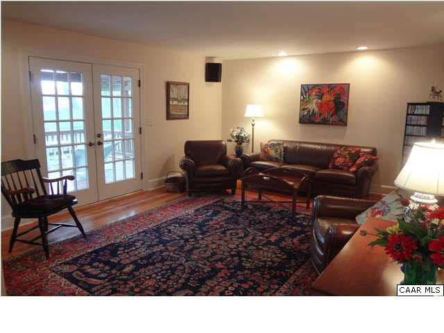 1436 Grove Road Charlottesville, VA 22901 - Photo 12 of 25 View from kitchen to family room. French doors open to large screened porch.