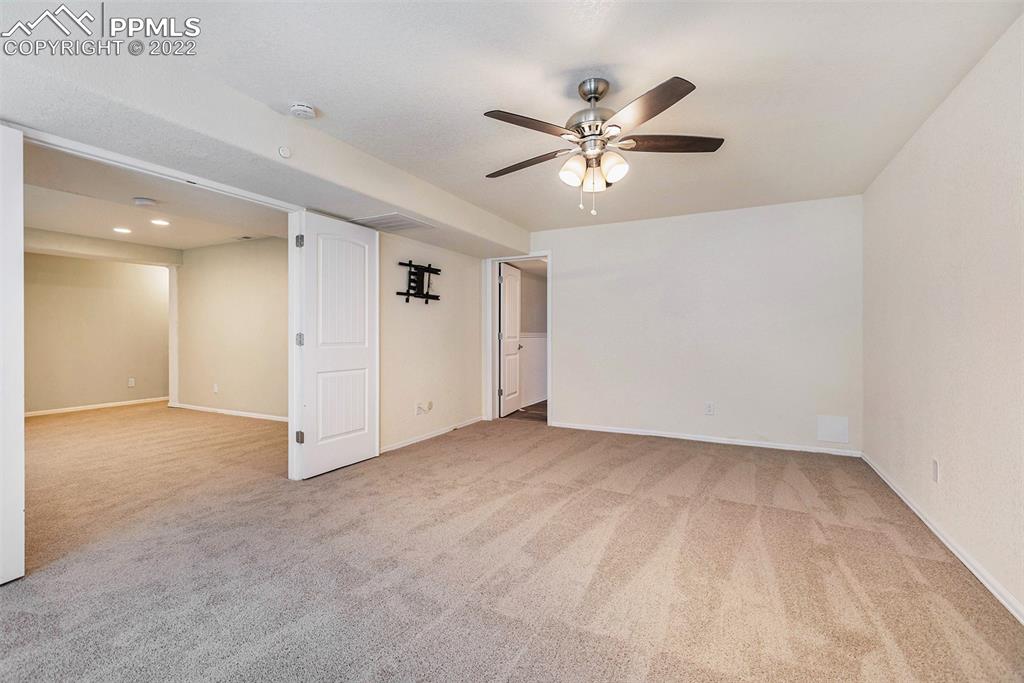 6139 Rocking Chair Lane Colorado Springs, CO 80925 - Photo 16 of 17 a view of an empty room