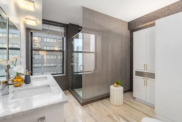 a kitchen with a sink and wooden floor