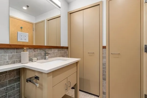 a bathroom with a sink and a mirror