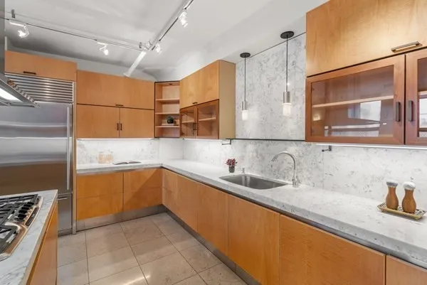 a kitchen with a sink and cabinets
