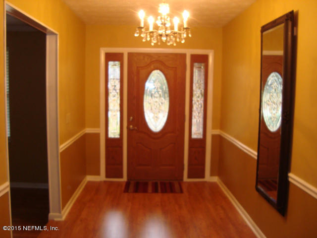 6910 Hermitage Road Jacksonville, FL 32277 - Photo 3 of 42 a view of a hallway with wooden floor