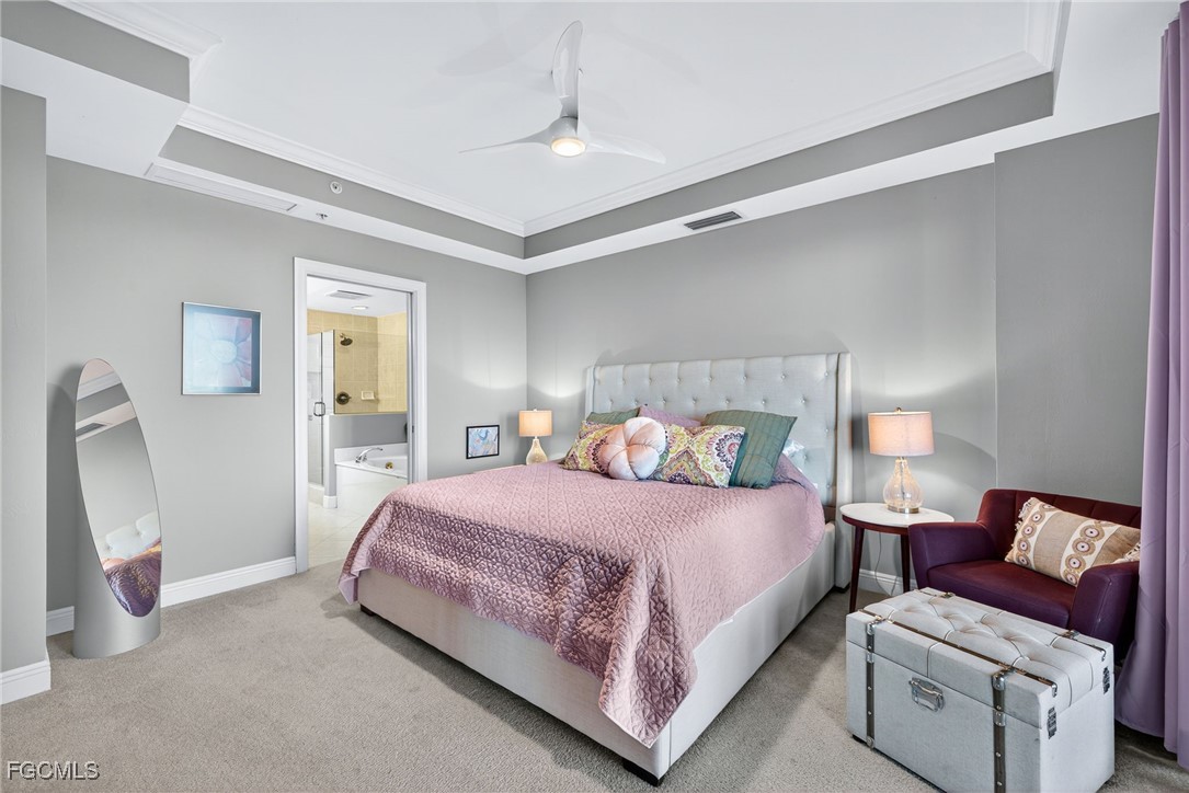 2743 First Street, Unit 701 Fort Myers, FL 33916 - Photo 16 of 31 a bedroom with a bed and a couch