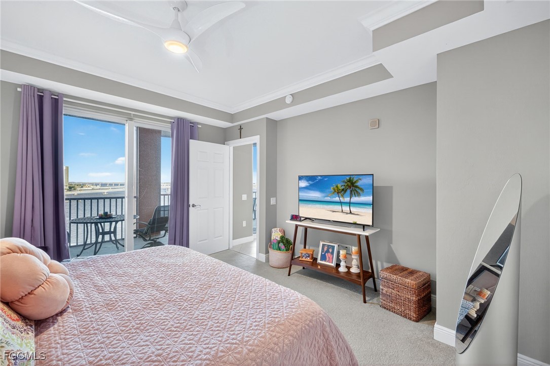 2743 First Street, Unit 701 Fort Myers, FL 33916 - Photo 17 of 31 a bedroom with a bed and a painting on the wall