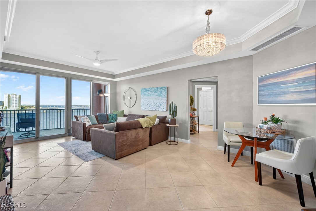 2743 First Street, Unit 701 Fort Myers, FL 33916 - Photo 8 of 31 a living room with furniture and a table