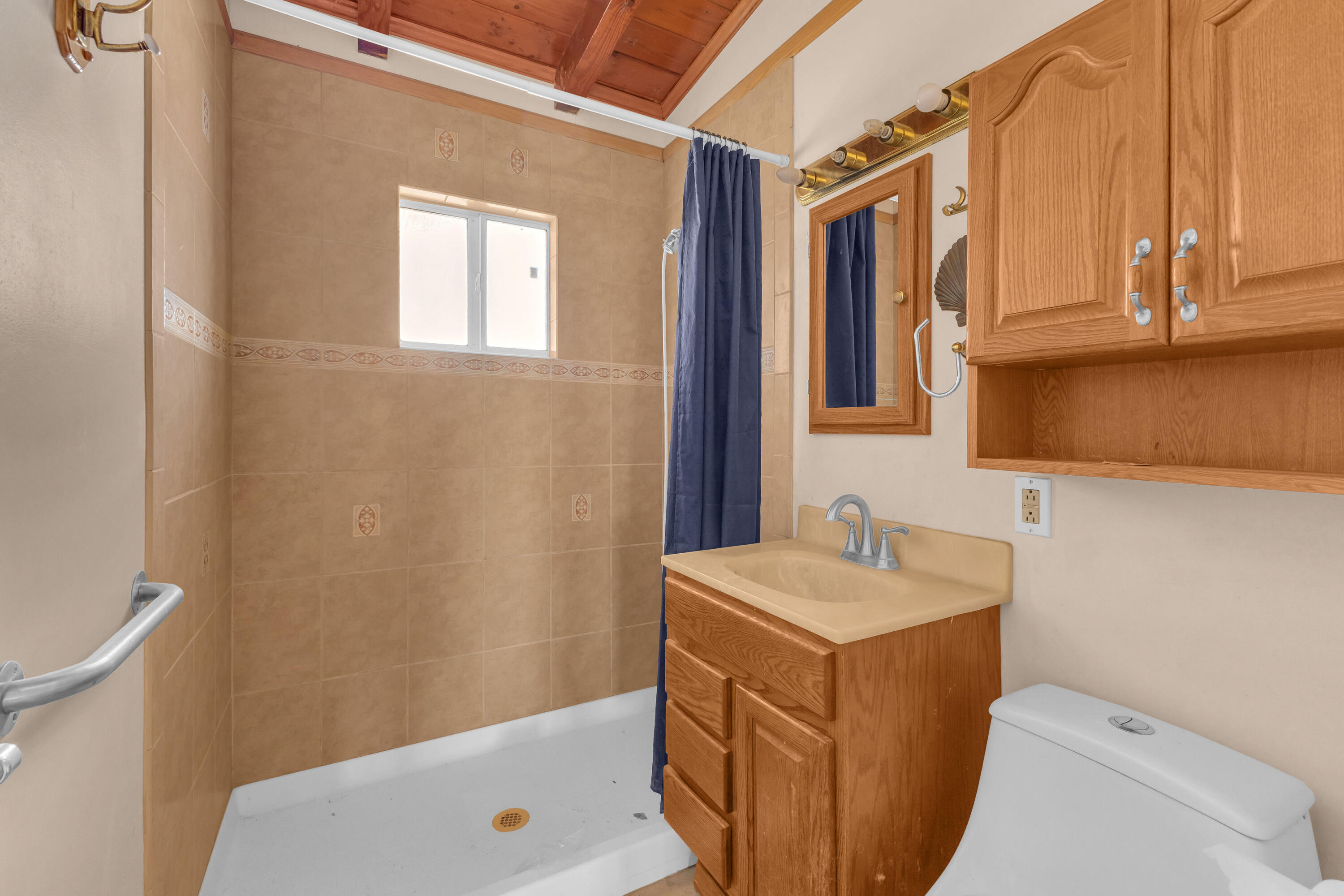 81975 Dillon Road Desert Hot Springs, CA 92241 - Photo 20 of 51 a bathroom with a sink a toilet and a mirror