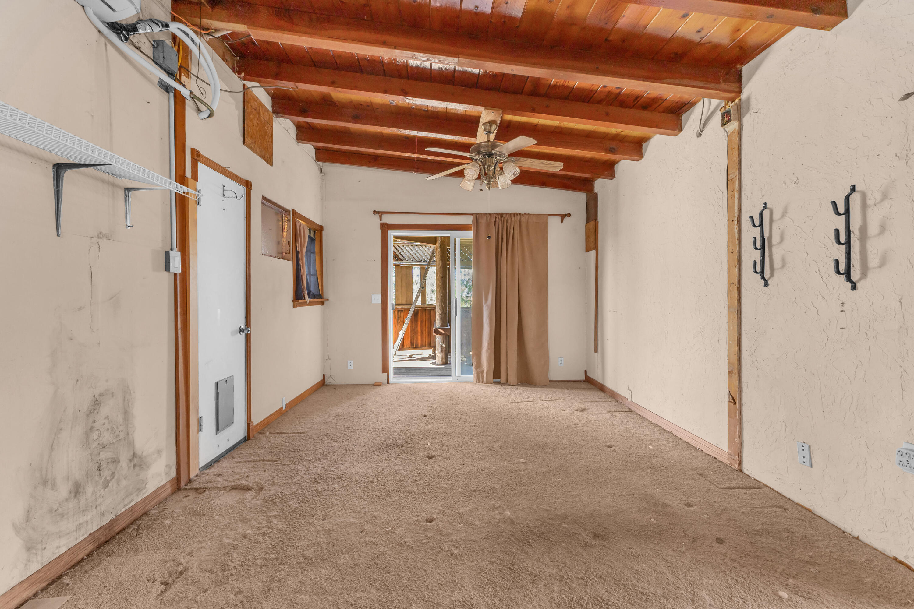 81975 Dillon Road Desert Hot Springs, CA 92241 - Photo 22 of 51 a view of a hallway with a white walls