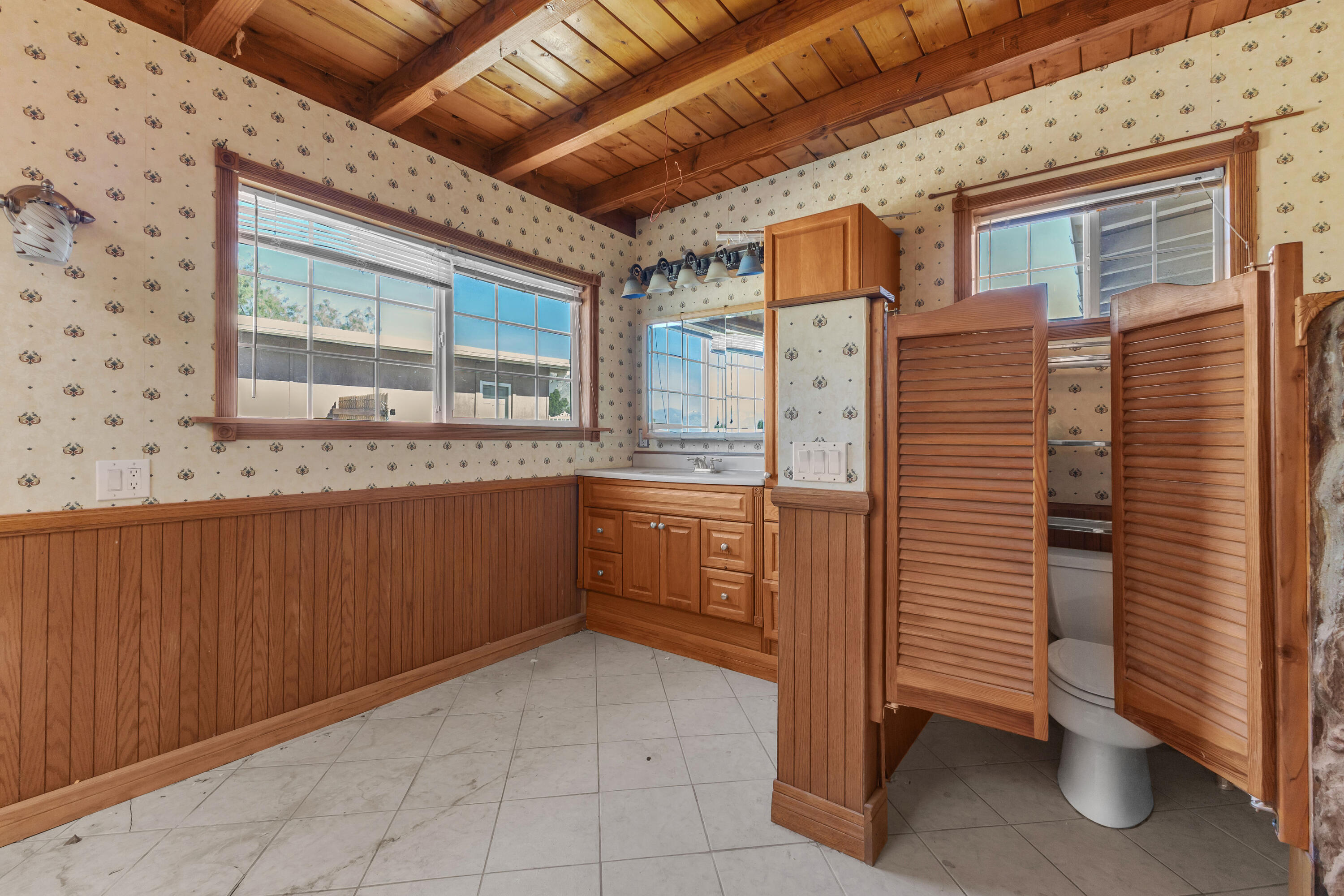 81975 Dillon Road Desert Hot Springs, CA 92241 - Photo 25 of 51 a bathroom with a granite countertop sink and washing machine