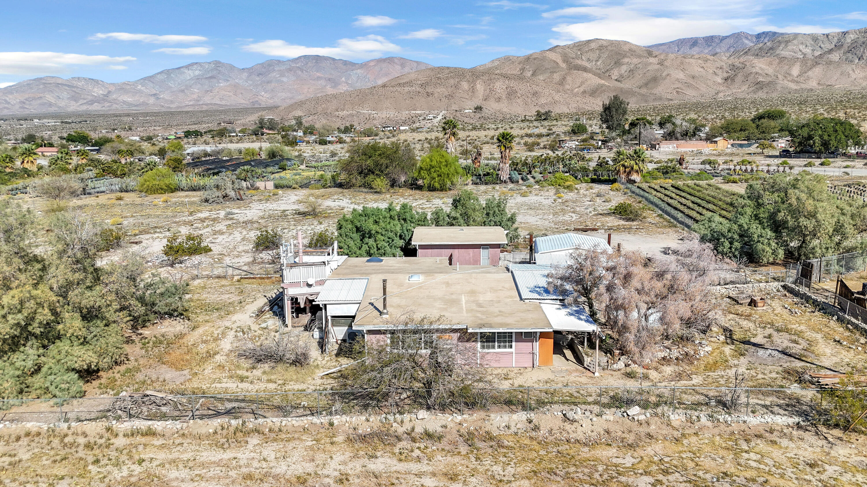 81975 Dillon Road Desert Hot Springs, CA 92241 - Photo 47 of 51 an aerial view of a house with a mountain