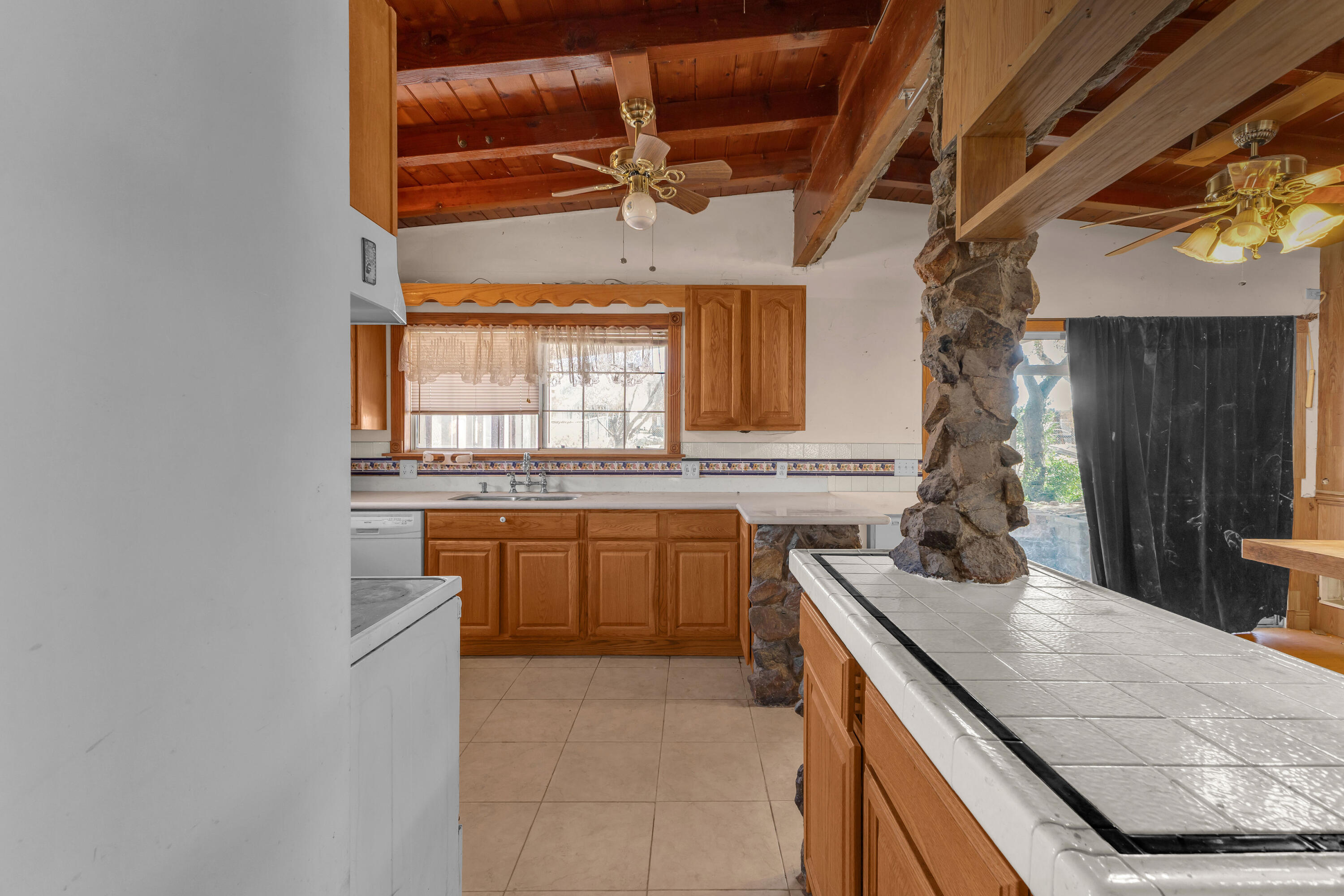 81975 Dillon Road Desert Hot Springs, CA 92241 - Photo 5 of 51 a kitchen with a sink stove and cabinets