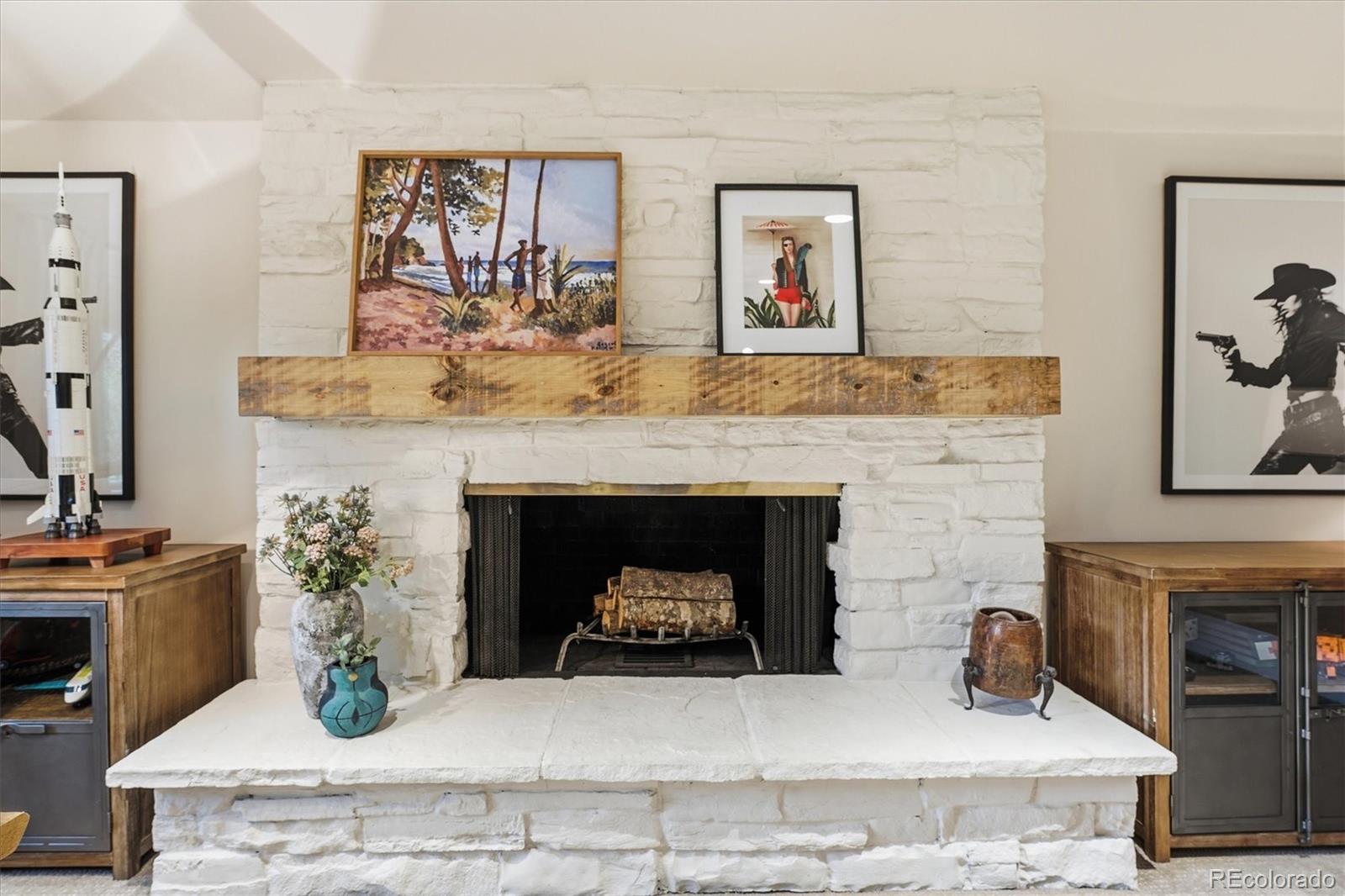 4607 West Wagon Trail Road Littleton, CO 80123 - Photo 26 of 49 a living room with furniture and a fireplace