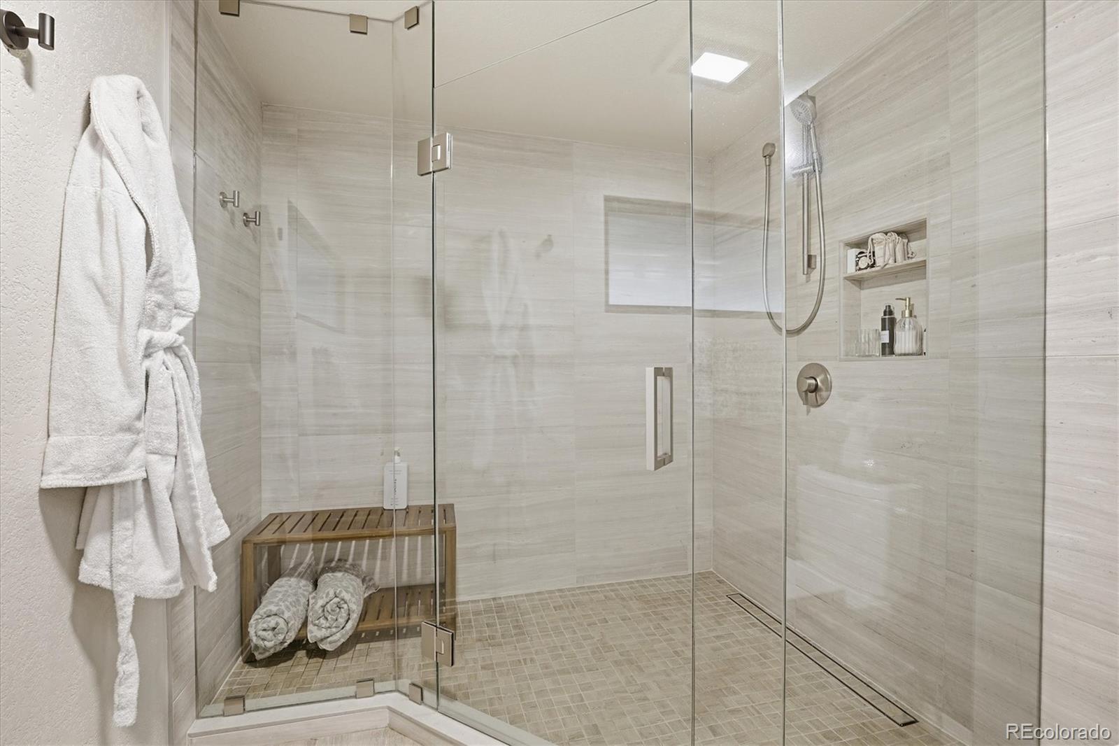 4607 West Wagon Trail Road Littleton, CO 80123 - Photo 30 of 49 a bathroom with a shower