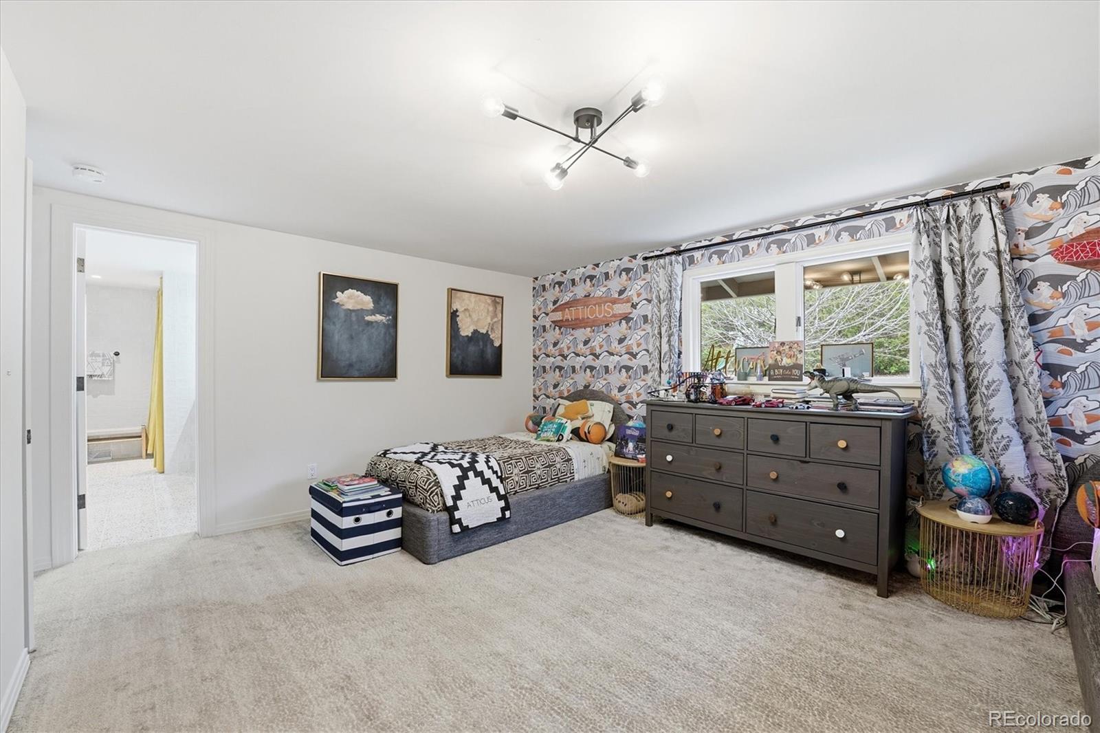 4607 West Wagon Trail Road Littleton, CO 80123 - Photo 32 of 49 a bed room with a bed and a window