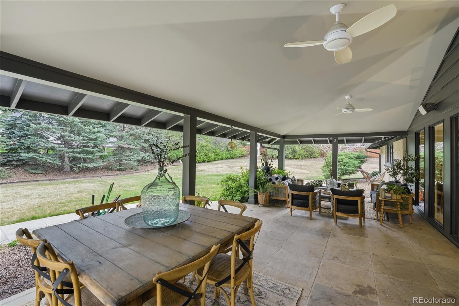 4607 West Wagon Trail Road Littleton, CO 80123 - Photo 42 of 49 a view of a dining room with furniture window and outside view