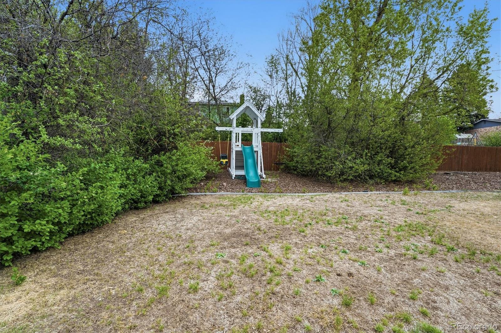 4607 West Wagon Trail Road Littleton, CO 80123 - Photo 45 of 49 a view of a park with large trees