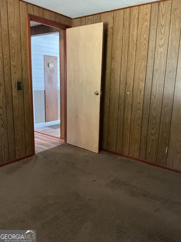 a view of a porch with wooden floor