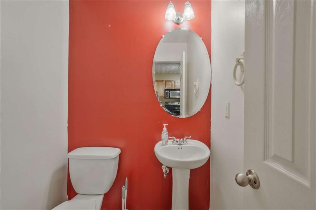 2870 Vining Ridge Terrace Decatur, GA 30034 - Photo 7 of 23 a bathroom with a toilet sink and mirror