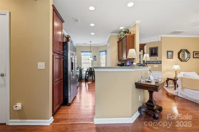 a view of a kitchen with dining table and chairs