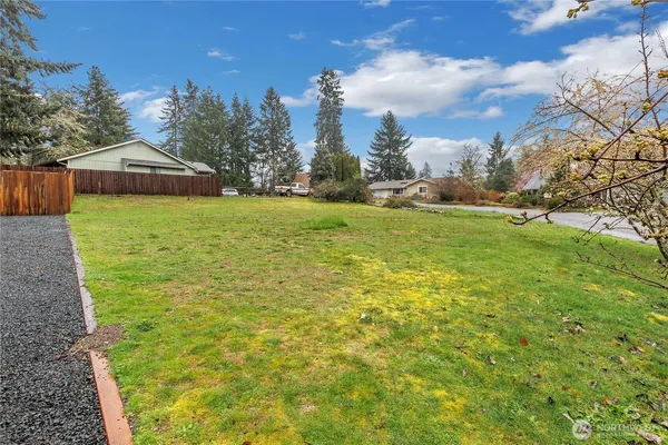 a aerial view of a house with a yard
