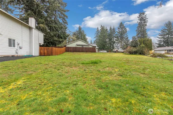 a view of a backyard of the house
