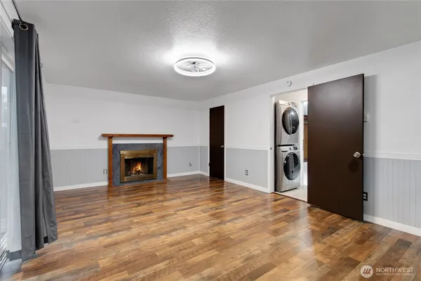 a view of an empty room with a fireplace