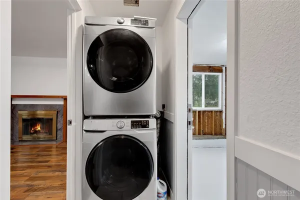 a view of a hallway with washer and dryer
