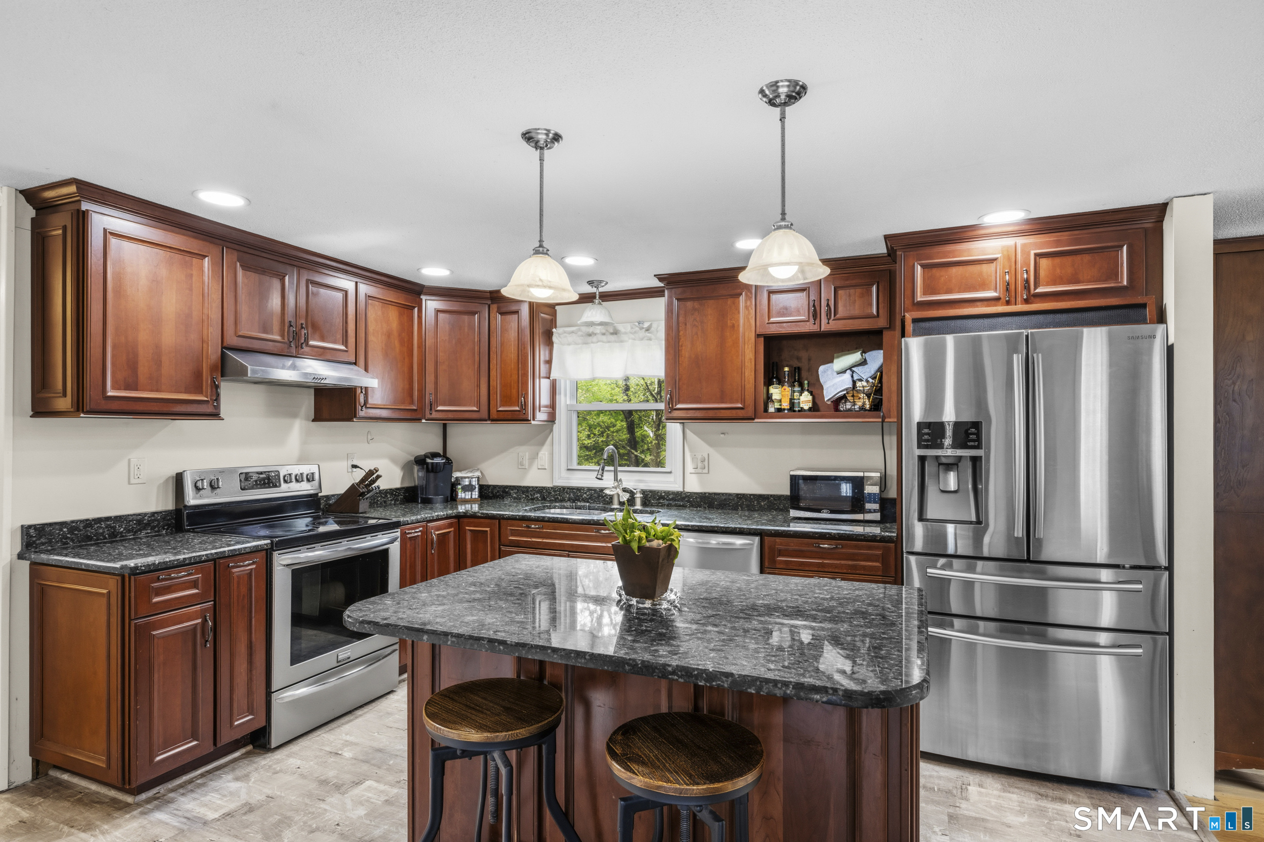 90 Sturtevant Street Norwich, CT 06360 - Photo 7 of 40 Fully updated kitchen with granite countertops and stainless steel appliances