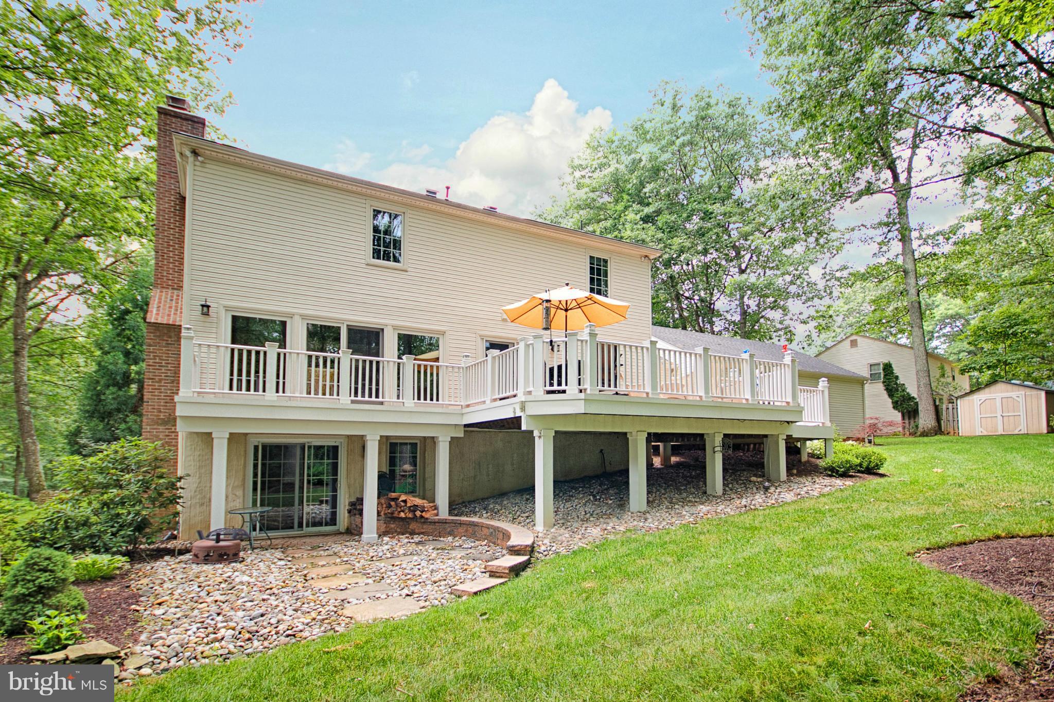 11008 Raccoon Ridge Court Reston, VA 20191 - Photo 16 of 30 a view of a house with a yard and sitting area
