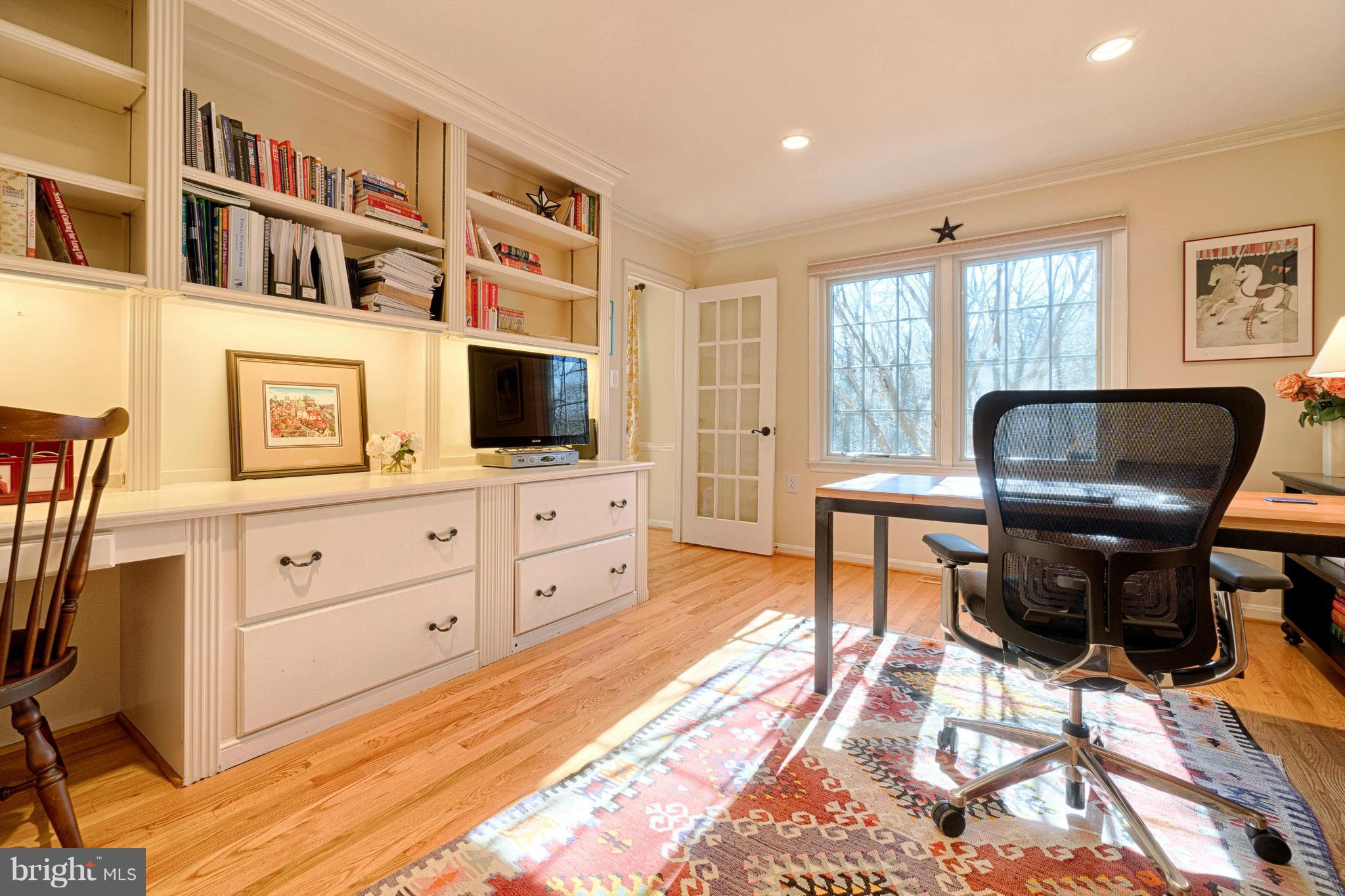 11008 Raccoon Ridge Court Reston, VA 20191 - Photo 19 of 30 a living room with furniture flat screen tv and chairs