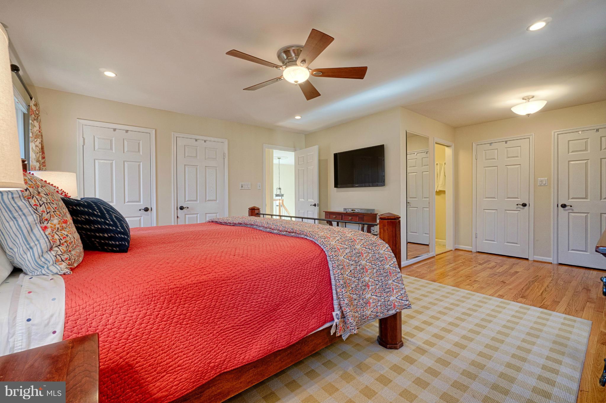 11008 Raccoon Ridge Court Reston, VA 20191 - Photo 23 of 30 a bed room with a bed and a ceiling fan