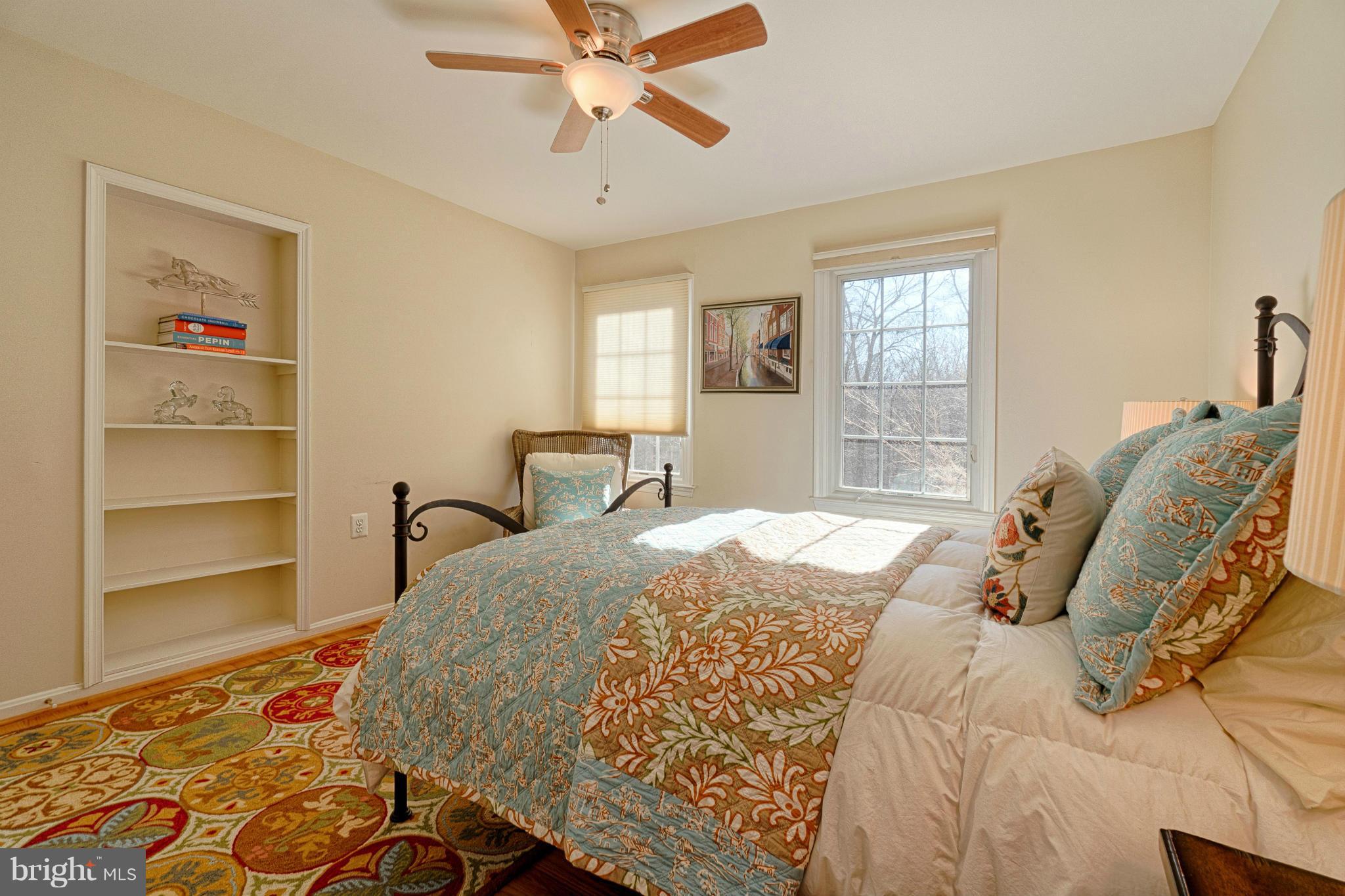 11008 Raccoon Ridge Court Reston, VA 20191 - Photo 25 of 30 a bedroom with a bed and a chandelier