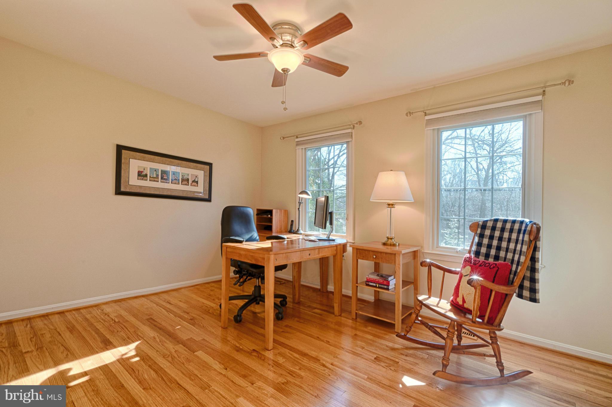 11008 Raccoon Ridge Court Reston, VA 20191 - Photo 26 of 30 a workspace with furniture a chandelier and wooden floor