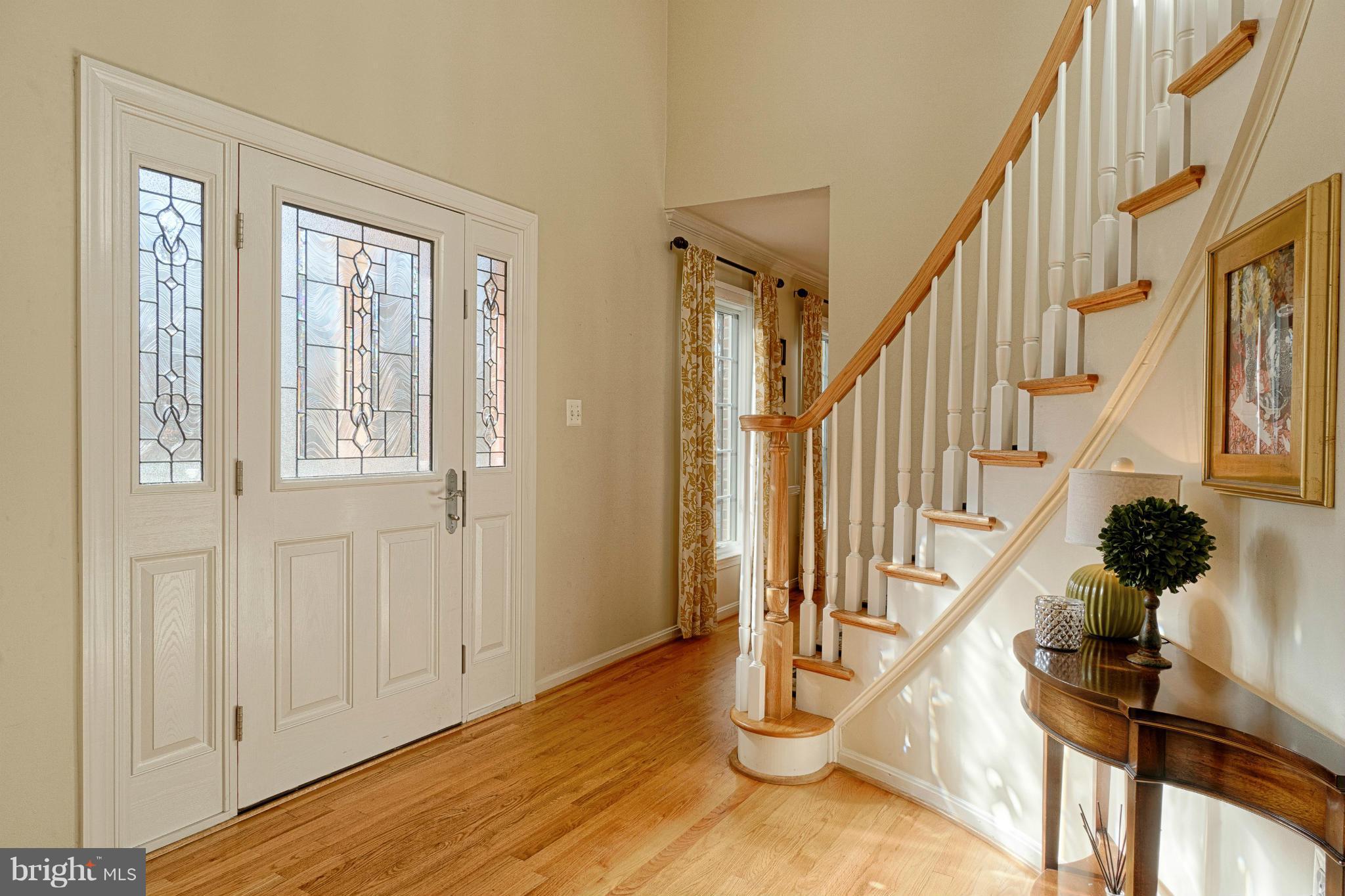 11008 Raccoon Ridge Court Reston, VA 20191 - Photo 5 of 30 a view of an entryway with wooden floor and staircase