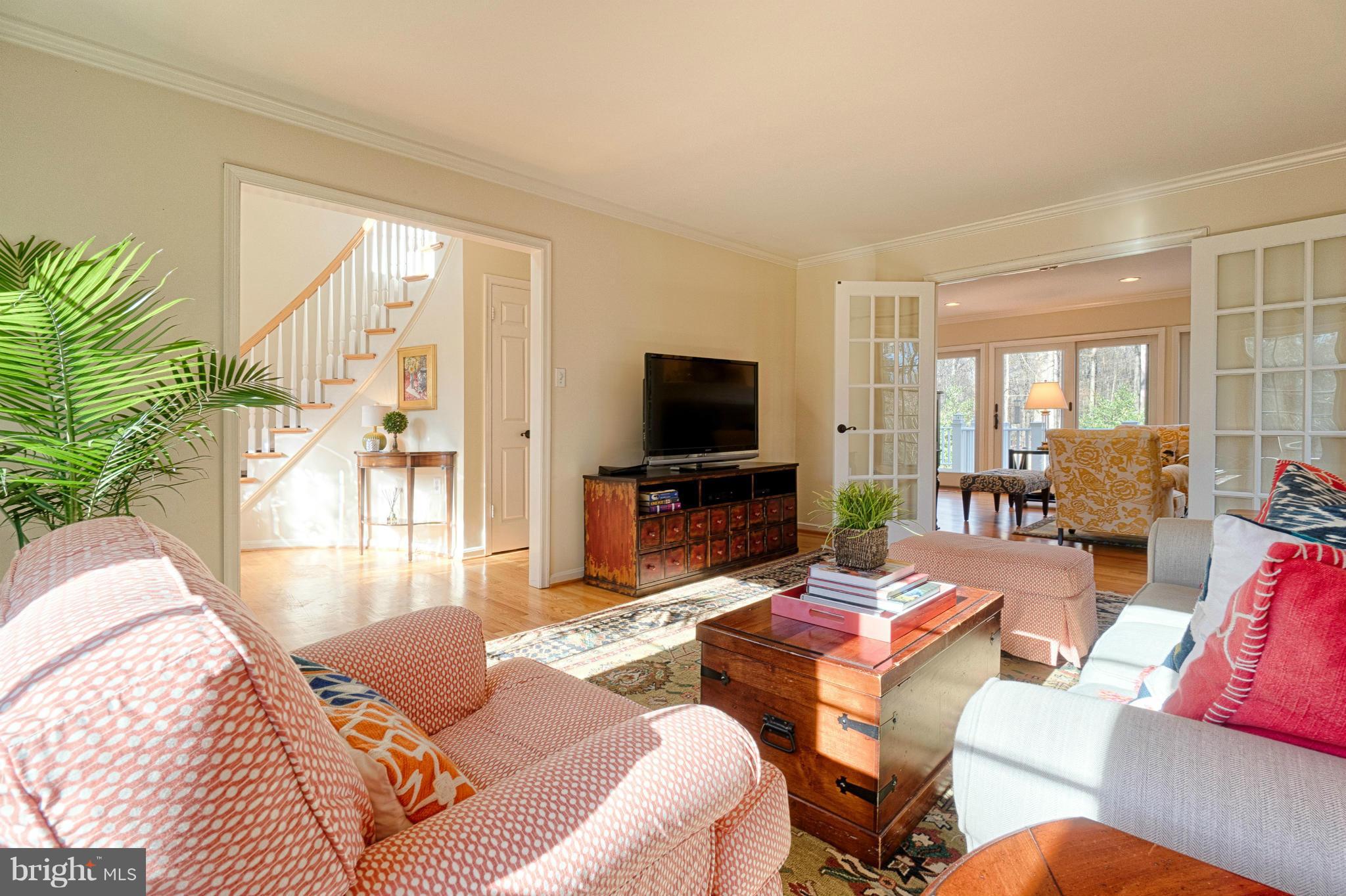 11008 Raccoon Ridge Court Reston, VA 20191 - Photo 7 of 30 a living room with furniture and a flat screen tv